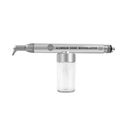Dental Aluminum Oxide Microblaster air abrasion handpiece with powder bottle, white background
