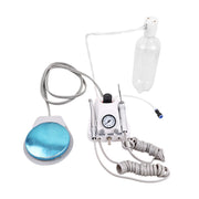 Mini portable dental air turbine unit with foot pedal and water bottle, white background