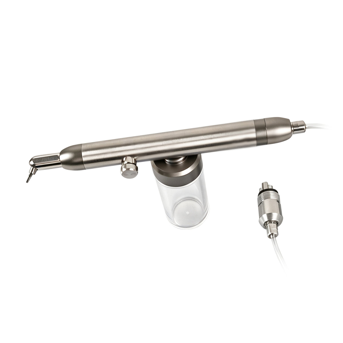 Sandblasting gun set placed on dental workbench